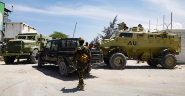 African Union peacekeepers stand next to armored personnel carriers (APC) as they provide security for members of the Lower House of Parliament who are meeting to elect a speaker, at the Aden Adde International Airport in Mogadishu, Somalia, April 27, 2022. (Reuters Photo)