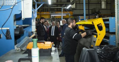 Italian Ambassador to Türkiye Giorgio Marrapodi (C) visits a factory in Bursa, northwestern Türkiye, Nov. 30, 2023.