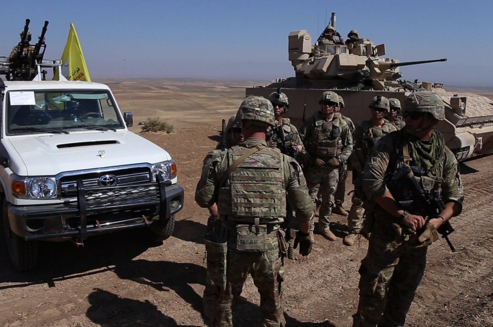 U.S. soldiers cluster as they conduct a joint military drill with PKK/YPG terrorists near the town of Qamishli in northeastern Hassakeh province, Syria, Aug. 18, 2023. (AA Photo)