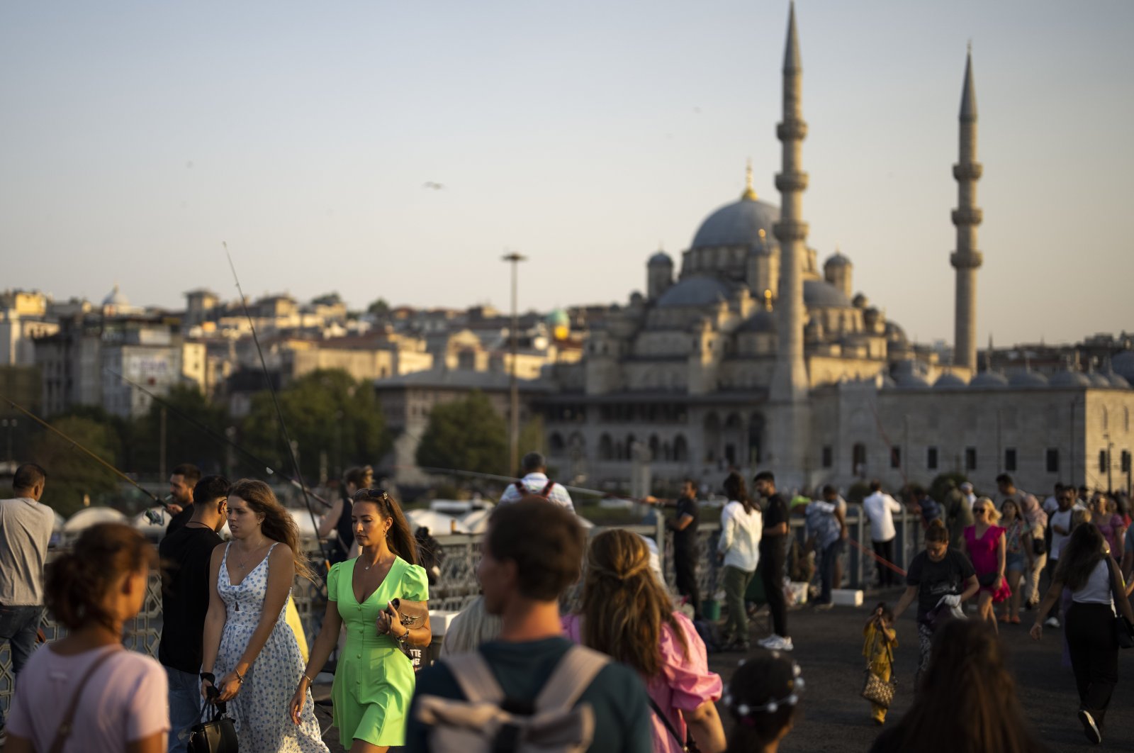 Locals and tourists walk over the Galata bridge in Istanbul, Türkiye, Aug. 16, 2023. (AP Photo)
