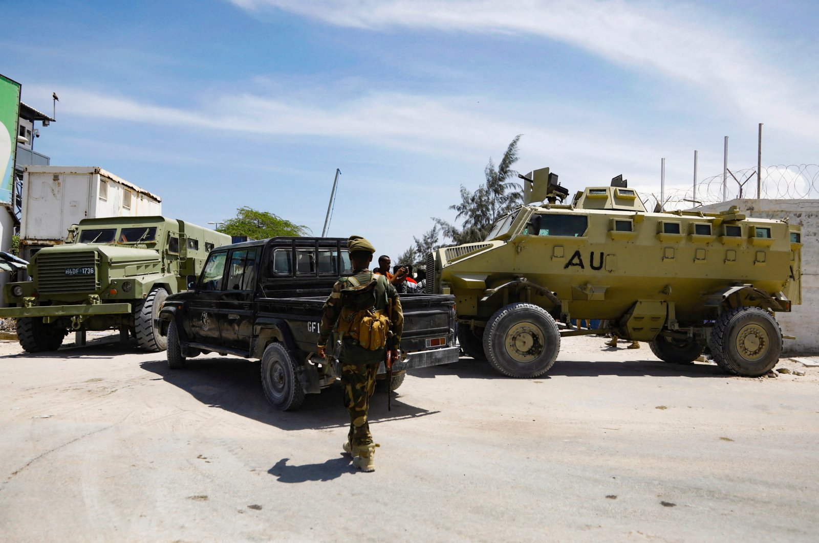 African Union peacekeepers stand next to armored personnel carriers (APC) as they provide security for members of the Lower House of Parliament who are meeting to elect a speaker, at the Aden Adde International Airport in Mogadishu, Somalia, April 27, 2022. (Reuters Photo)