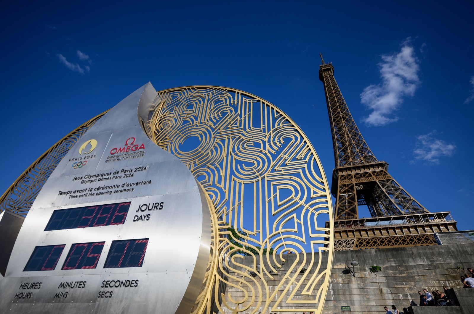 The official Olympic countdown clock near the Eiffel Tower displays the remaining days and time until the 2024 Summer Olympics, Paris, France, July 6, 2023. (Getty Images Photo)