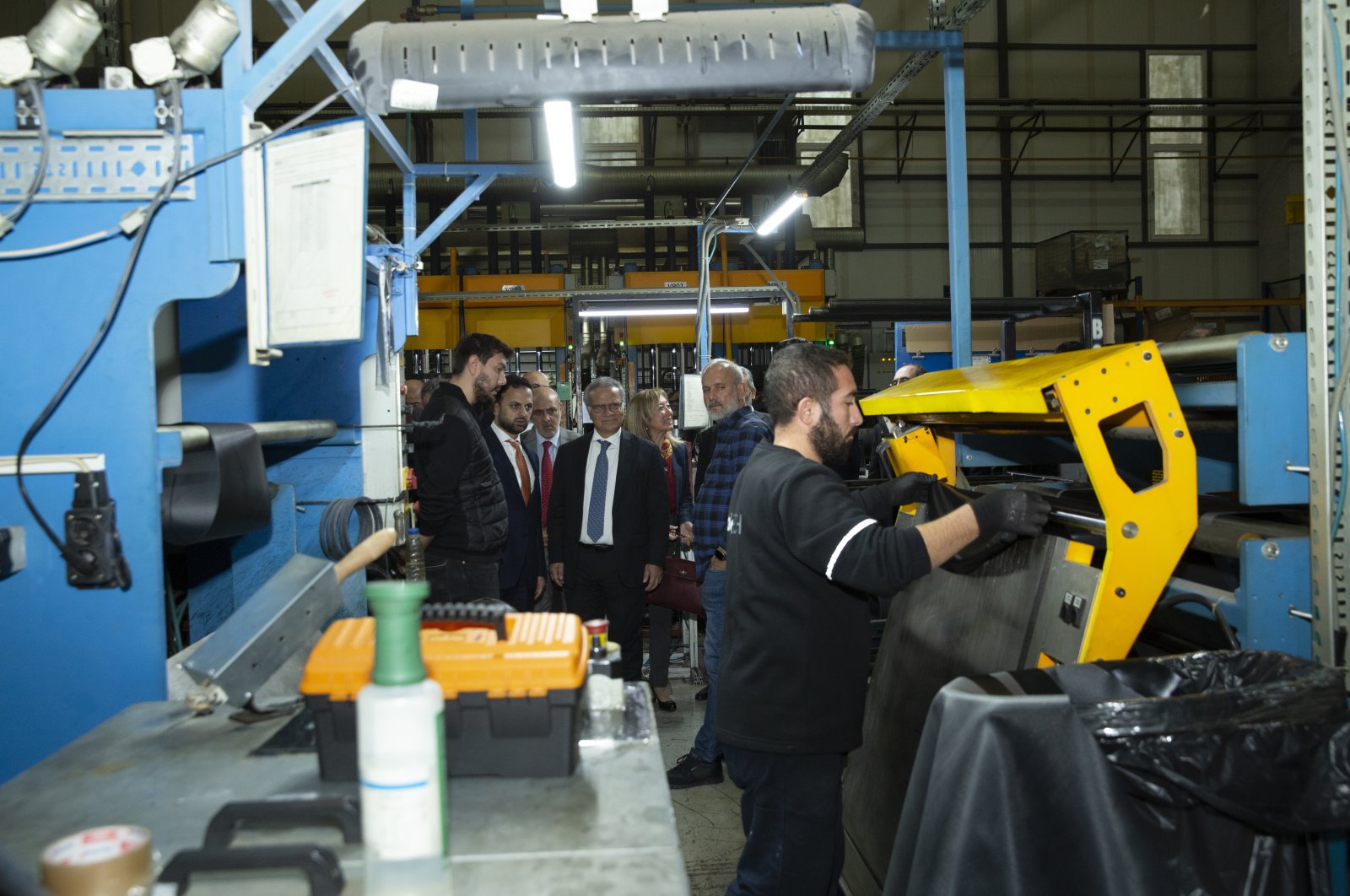 Italian Ambassador to Türkiye Giorgio Marrapodi (C) visits a factory in Bursa, northwestern Türkiye, Nov. 30, 2023.