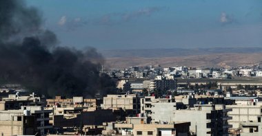 Smoke billows in Qamishli in northeastern Syria close to the Turkish border on Dec. 25, 2023, amid Turkish counterterrorism operations in the area. (AFP File Photo)