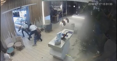 Camera footage shows the moment of the 2019 attack on Turkish diplomat Osman Köse by PKK terrorists in a restaurant in Irbil, Iraq. (DHA Photo)