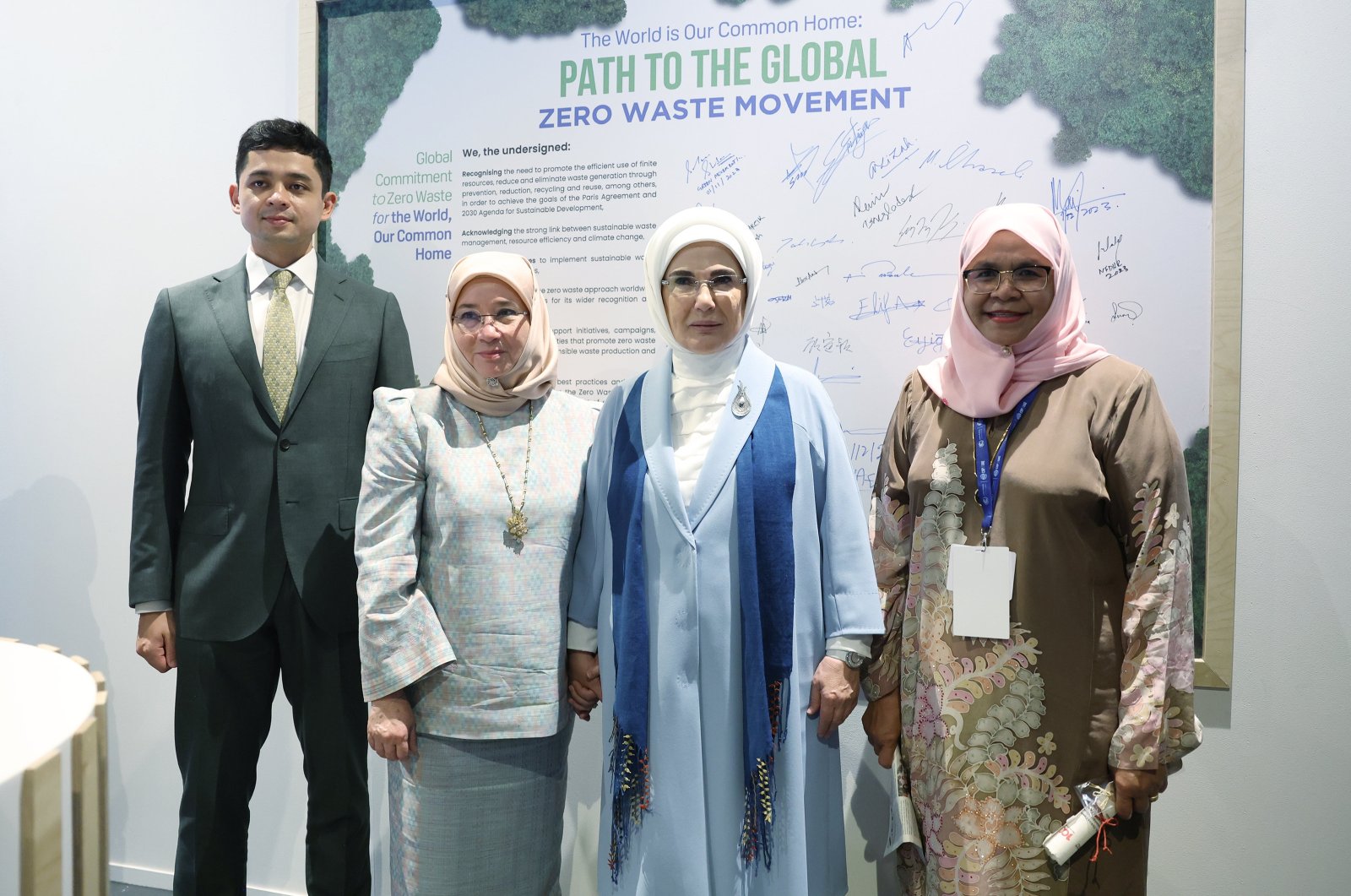 First lady Emine Erdoğan (C) and U.N.-Habitat Executive Director Maimunah Mohd Sharif (R) are photographed during a program with young climate ambassadors at the COP 28 summit, Expo City Dubai, United Arab Emirates (UAE), Dec. 1, 2023. (AA Photo)