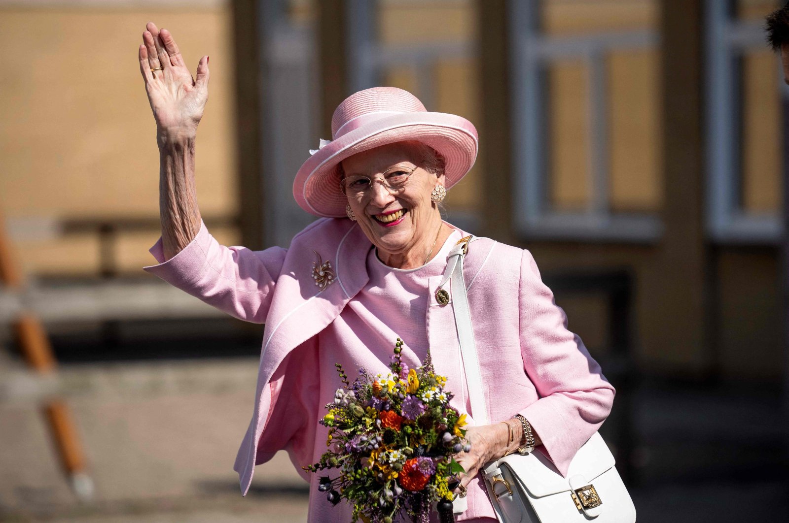 Queen Margrethe II of Denmark waves to onlookers as she visits Fredericia Municipality, Denmark, Sept. 1, 2023, (AFP Photo)