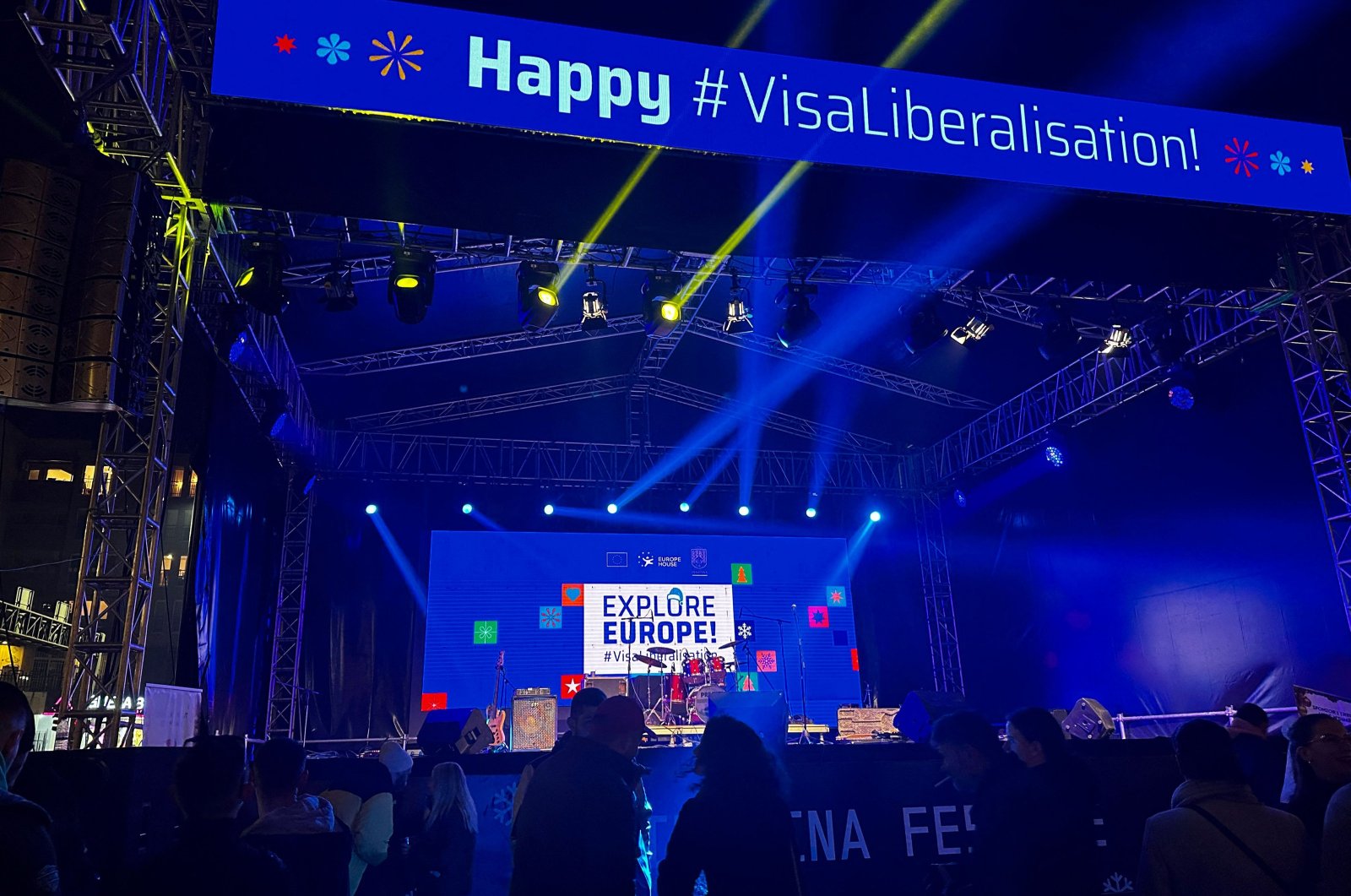 A message on a music stage reading "Happy #VisaLiberalization" is displayed during a music event in Pristina, Kosovo, Dec. 30, 2023. (AFP Photo)