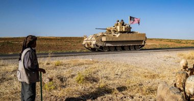 U.S. soldiers in a Bradley Fighting Vehicle patrol the countryside of al-Malikiya town in northeastern Hassakeh province, Syria, July 17, 2023. (AFP Photo)