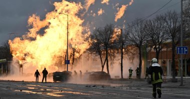 Ukrainian firefighters attempt to extinguish a fire after a missile strike in Kyiv, Ukraine, Jan. 2, 2024. (AFP Photo)