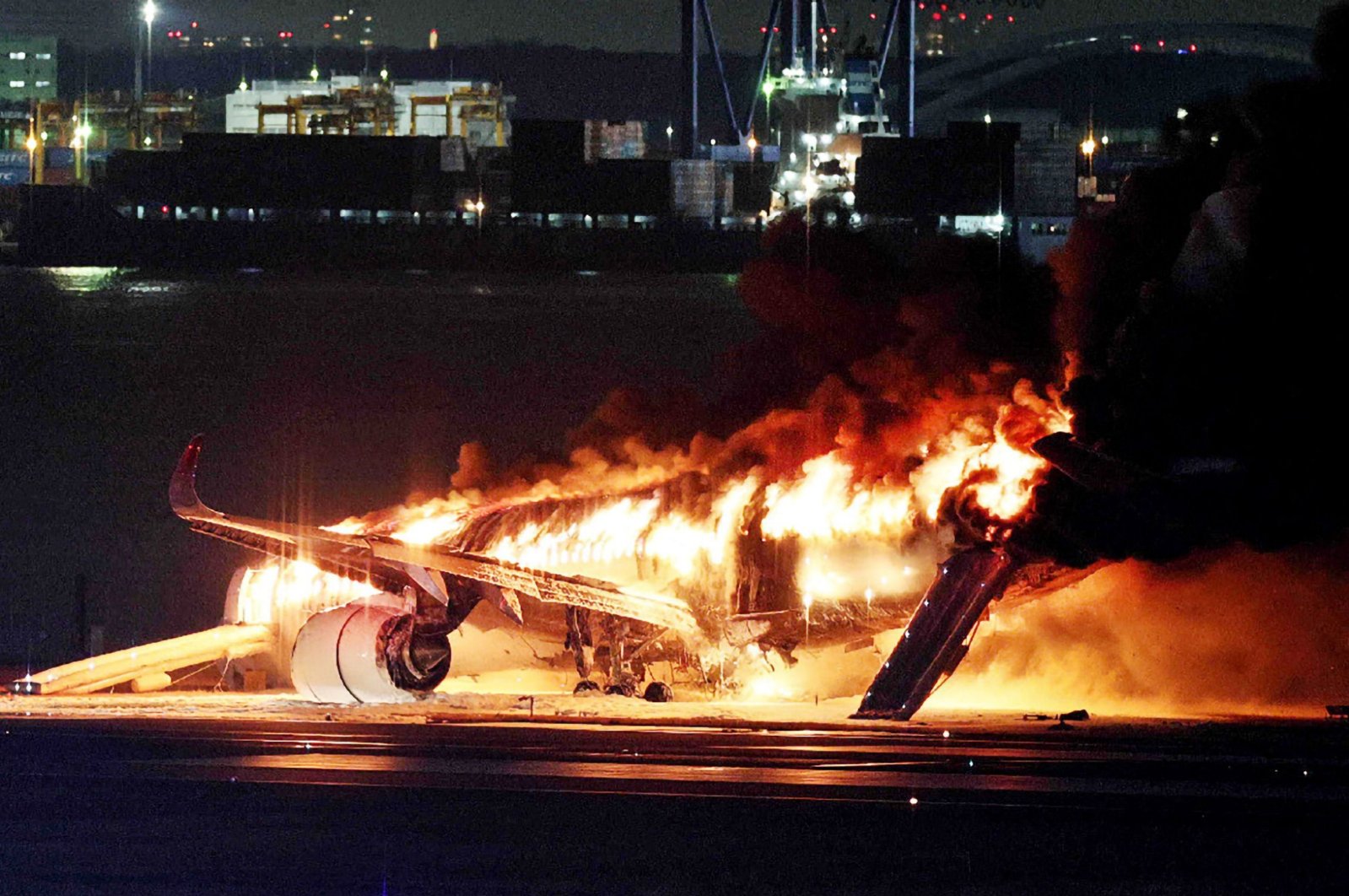 A Japan Airlines plane engulfed in fire on a runway at Haneda Airport, Tokyo, Japan, Jan. 2, 2024. (AFP Photo)