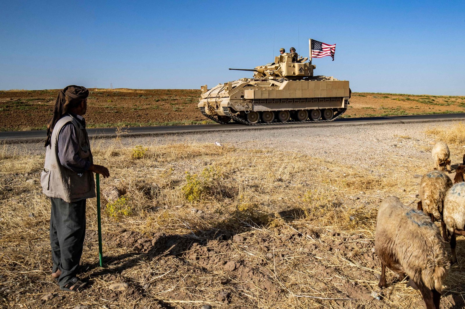 U.S. soldiers in a Bradley Fighting Vehicle patrol the countryside of al-Malikiya town in northeastern Hassakeh province, Syria, July 17, 2023. (AFP Photo)