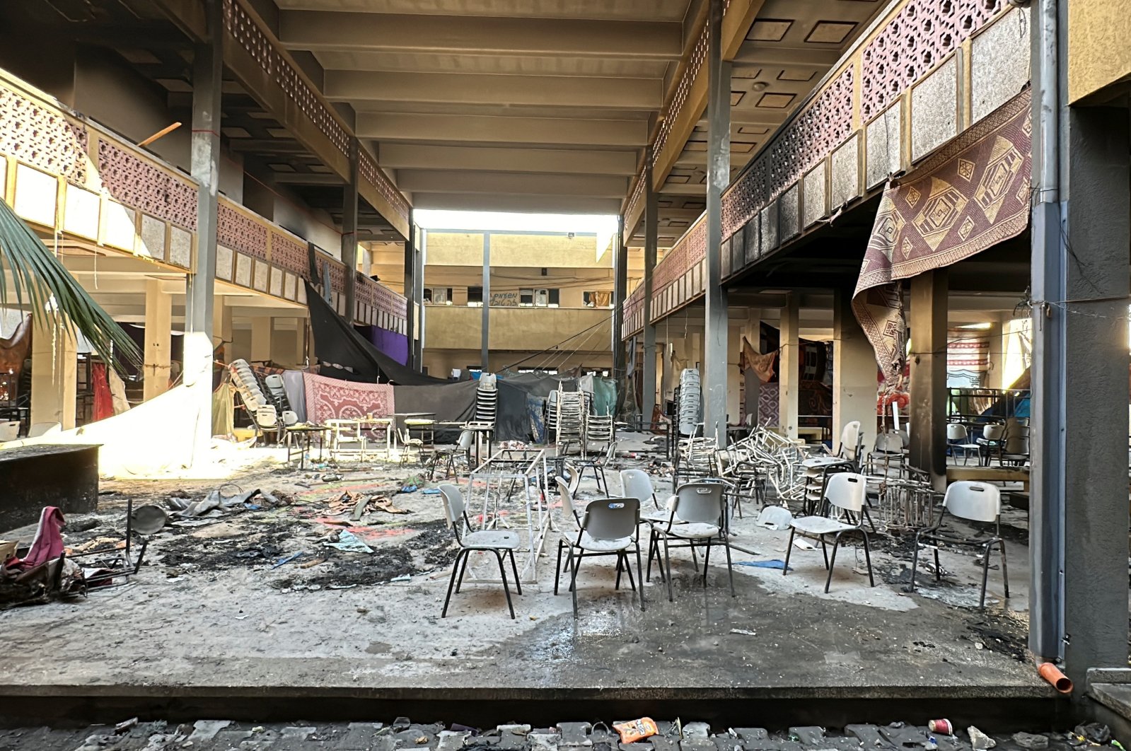 Damaged chairs stand amid debris at Shadia Abu Ghazaleh school following an Israeli raid, Jabalia, northern Gaza Strip, Palestine, Dec. 15, 2023. (Reuters Photo)
