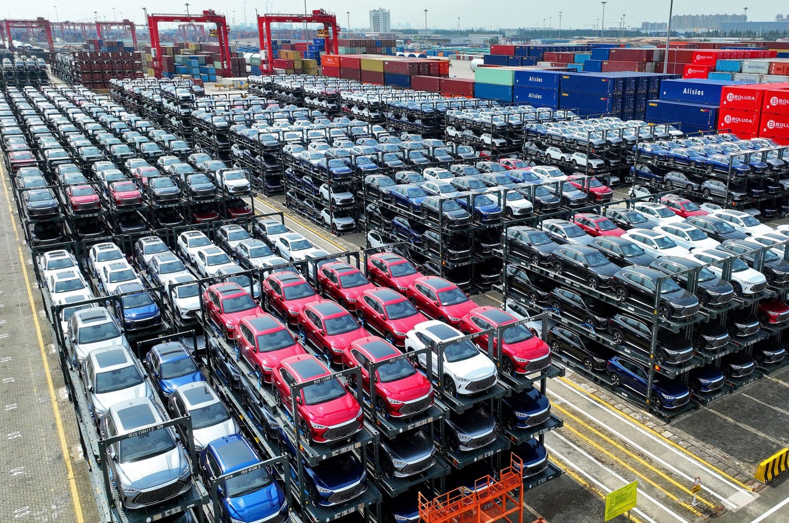  BYD electric cars waiting to be loaded on a ship are stacked at the international container terminal of Taicang Port at Suzhou Port, in China’s eastern Jiangsu Province, Sept.11, 2023. (AFP File Photo)