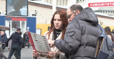 Customers checking the price list of a local restaurant, Istanbul, Türkiye, Jan.1, 2024. (DHA Photo)