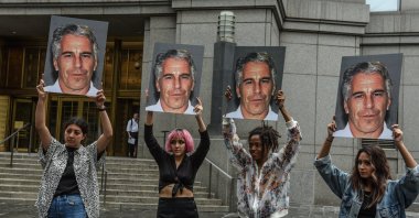 A protest group hold up signs of Jeffrey Epstein in front of the Federal courthouse, in New York City, U.S., July 8, 2019. (Getty Images)