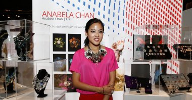 Designer Anabela Chan stands with her jewelry display at the International Design Showcase during the Vogue Fashion Dubai Experience, Dubai, United Arab Emirates. Oct. 31, 2014 (Getty Images Photo)