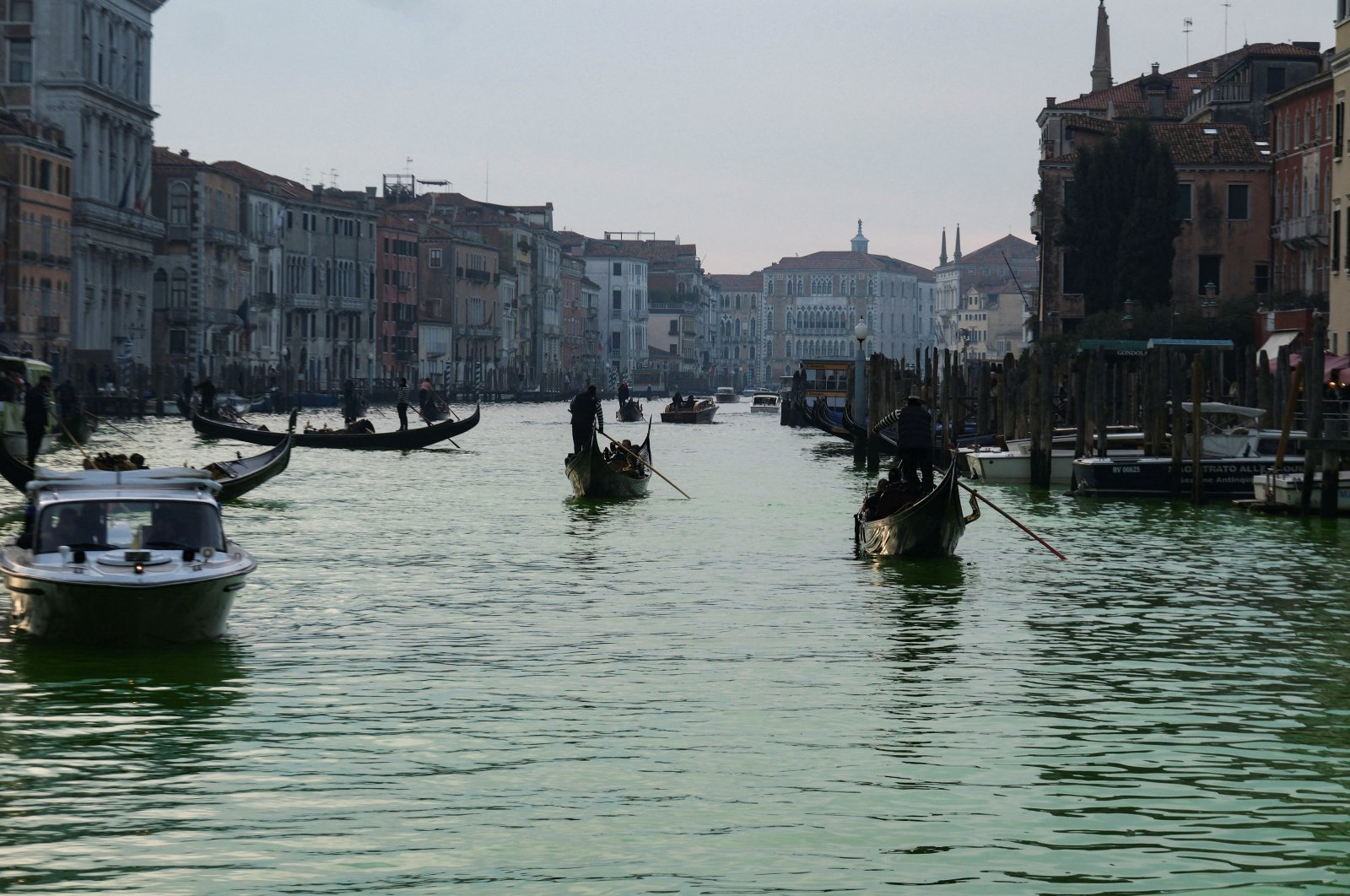 People ride in boats as waters of Grand Canal turned green after a protest by &#039;Extinction Rebellion&#039; climate activists in Venice, Italy, Dec. 9, 2023. (Reuters Photo)