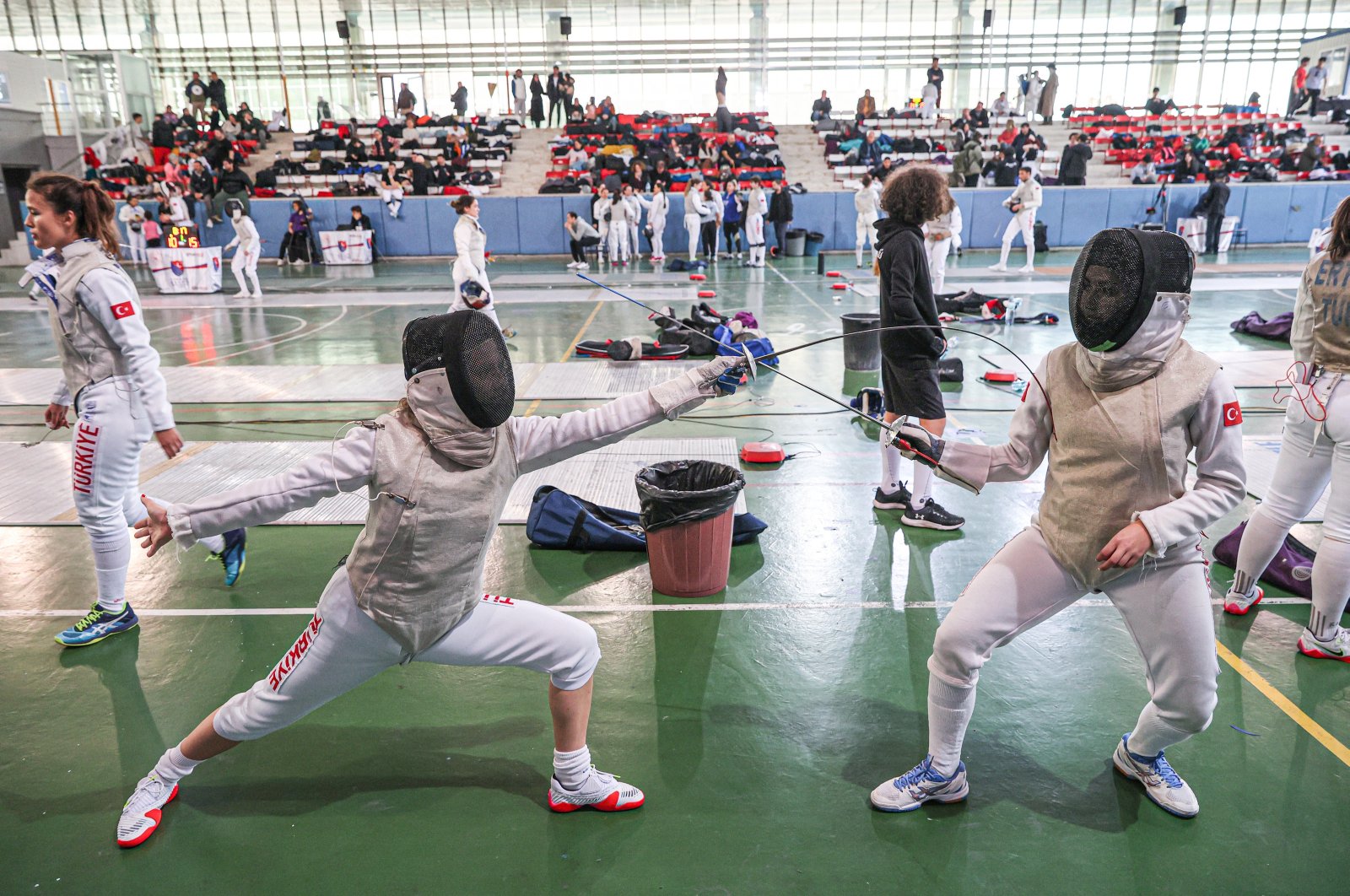 Fencers in action during the Senior Foil Foil Open Fencing Tournament at Gazi University BESYO Sports Hall, Ankara, Türkiye, Dec. 24, 2023. (AA Photo)