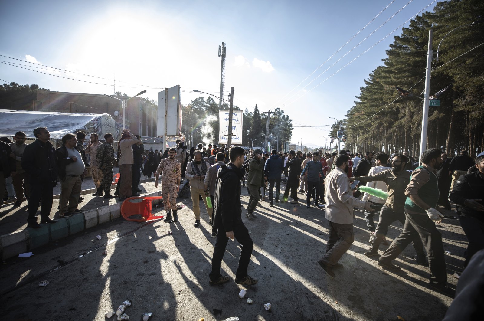 People are seen after an explosion in Kerman, Iran, Jan. 3, 2024. (AP Photo)