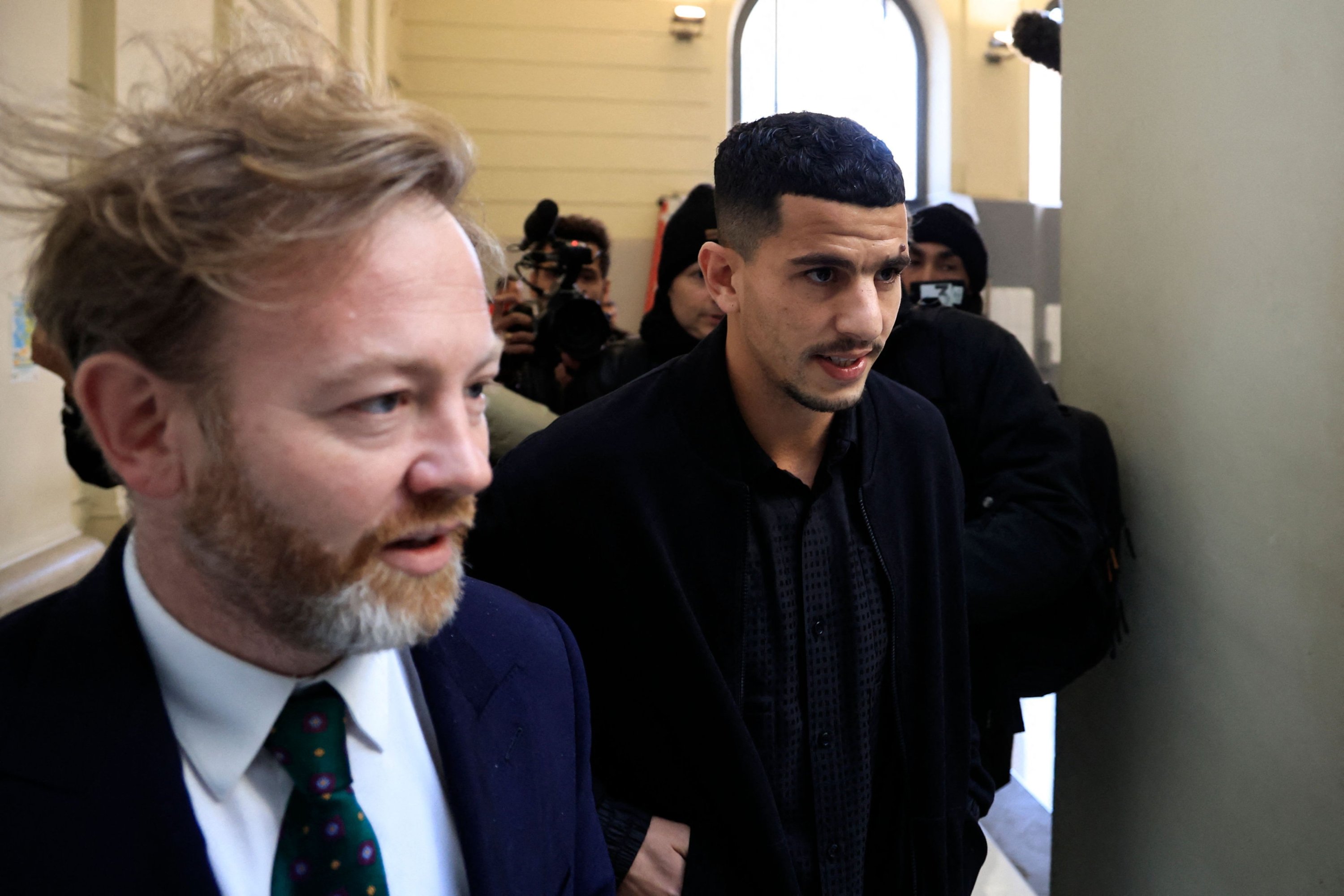 Nice's Algerian defender Youcef Atal (C) arrives with his lawyer Antoine Vey (L) at Nice courthouse, Nice, France, Dec. 18,2023. (AFP Photo)