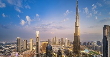 An aerial view shows the city buildings during a sunset in Dubai, United Arab Emirates, March 2, 2023. (Getty Images Photo)