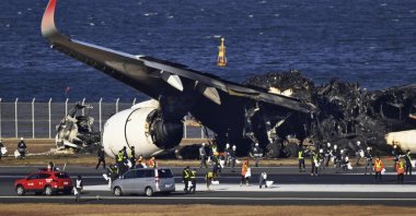 The burned Japan Airlines plane is seen at the Haneda airport in Tokyo, Japan, Jan. 4, 2024. (AP Photo)