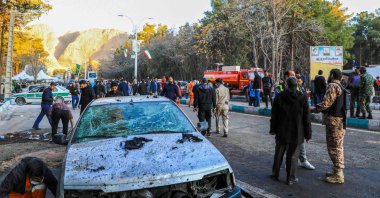 This picture shows people and Iranian emergency personnel at the site where two explosions in quick succession struck a crowd marking the anniversary of the 2020 killing of Guards general Qasem Soleimani, near the Saheb al-Zaman Mosque in the southern city of Kerman, Iran, Jan. 3, 2024. (AFP Photo)