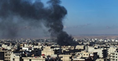 Smoke billows after a Turkish military operation, in Qamishli, northeastern Syria, Dec. 25, 2023. (AFP Photo)