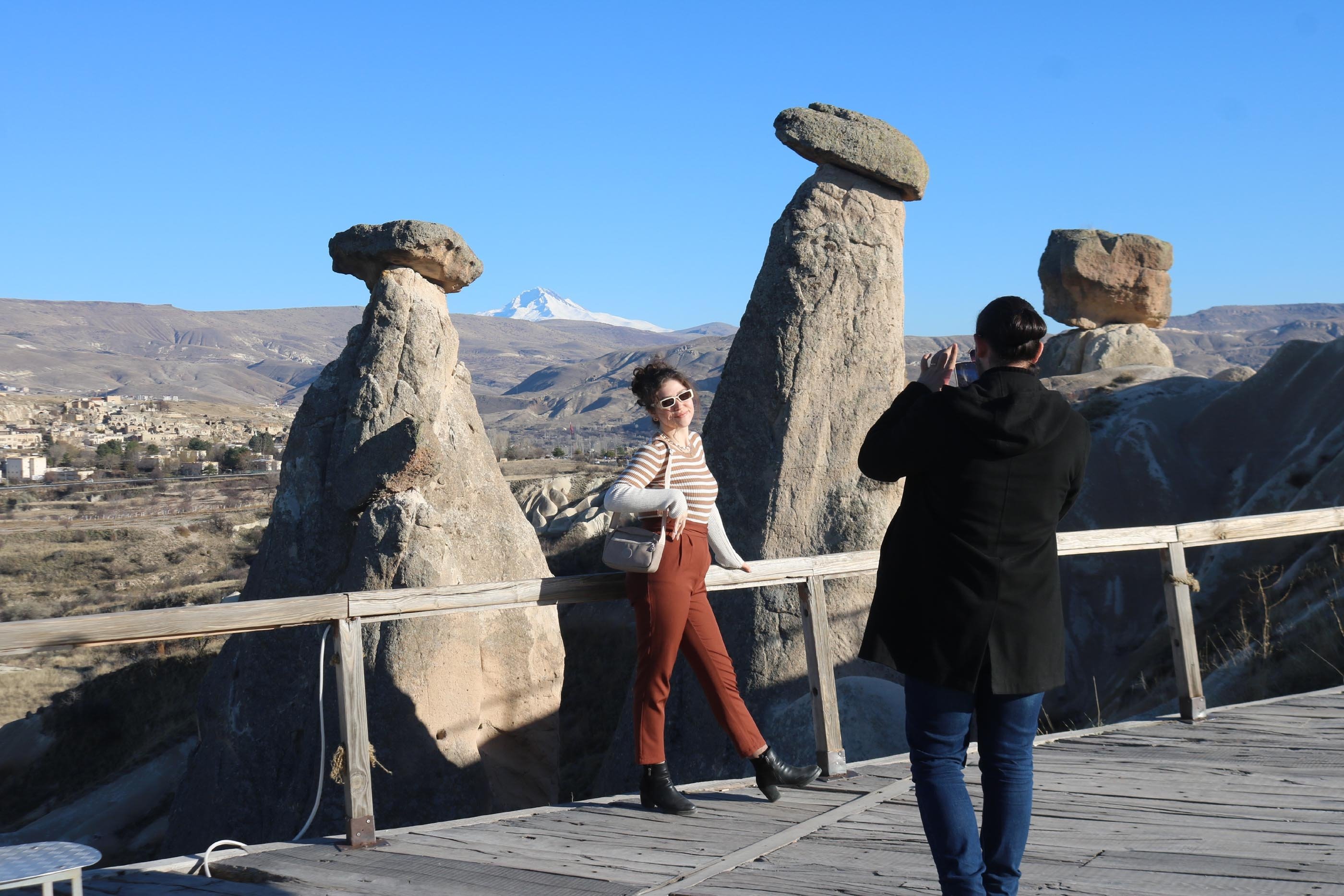 A tourist is seen posing for the photo in Cappadocia, Nevşehir, central Türkiye, Jan. 4, 2024. (DHA Photo)