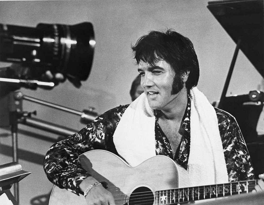 Elvis Presley plays guitar during a scene from the documentary film Elvis: That&#039;s the Way It Is. (Getty Images Photo)