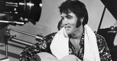 Elvis Presley plays guitar during a scene from the documentary film Elvis: That&#039;s the Way It Is. (Getty Images Photo)