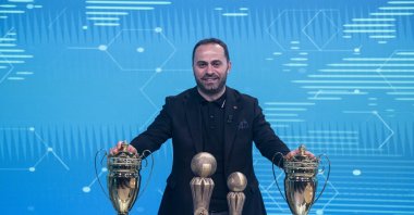 Kerim Vural, president of the Hearing Impaired Sports Federation poses with trophies after an interview, Istanbul, Türkiye, Dec. 28, 2023. (AA Photo)