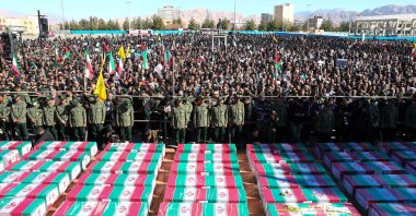 Coffins draped with the Iranian flag during the funeral of victims killed in twin blasts on Jan. 3, as they took part in a commemmoration marking the anniversary of the killing of Revolutionary Guards general Qasem Soleimani in the southern Iranian city of Kerman, Iran, Jan. 5, 2024. (AFP Photo)