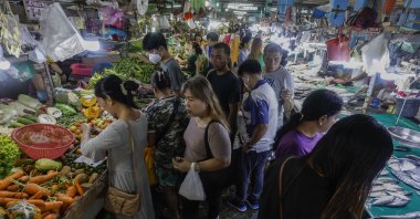 Customers gather to buy food items at a market in Quezon City, Metro Manila, Philippines, Jan. 5, 2024. (EPA Photo)