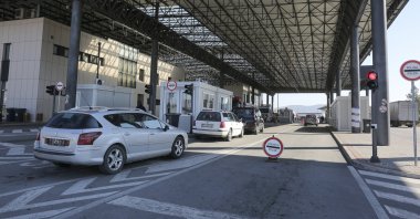 Cars wait in line at the Merdare border crossing on Monday, Oct. 4, 2021. (AP File Photo)