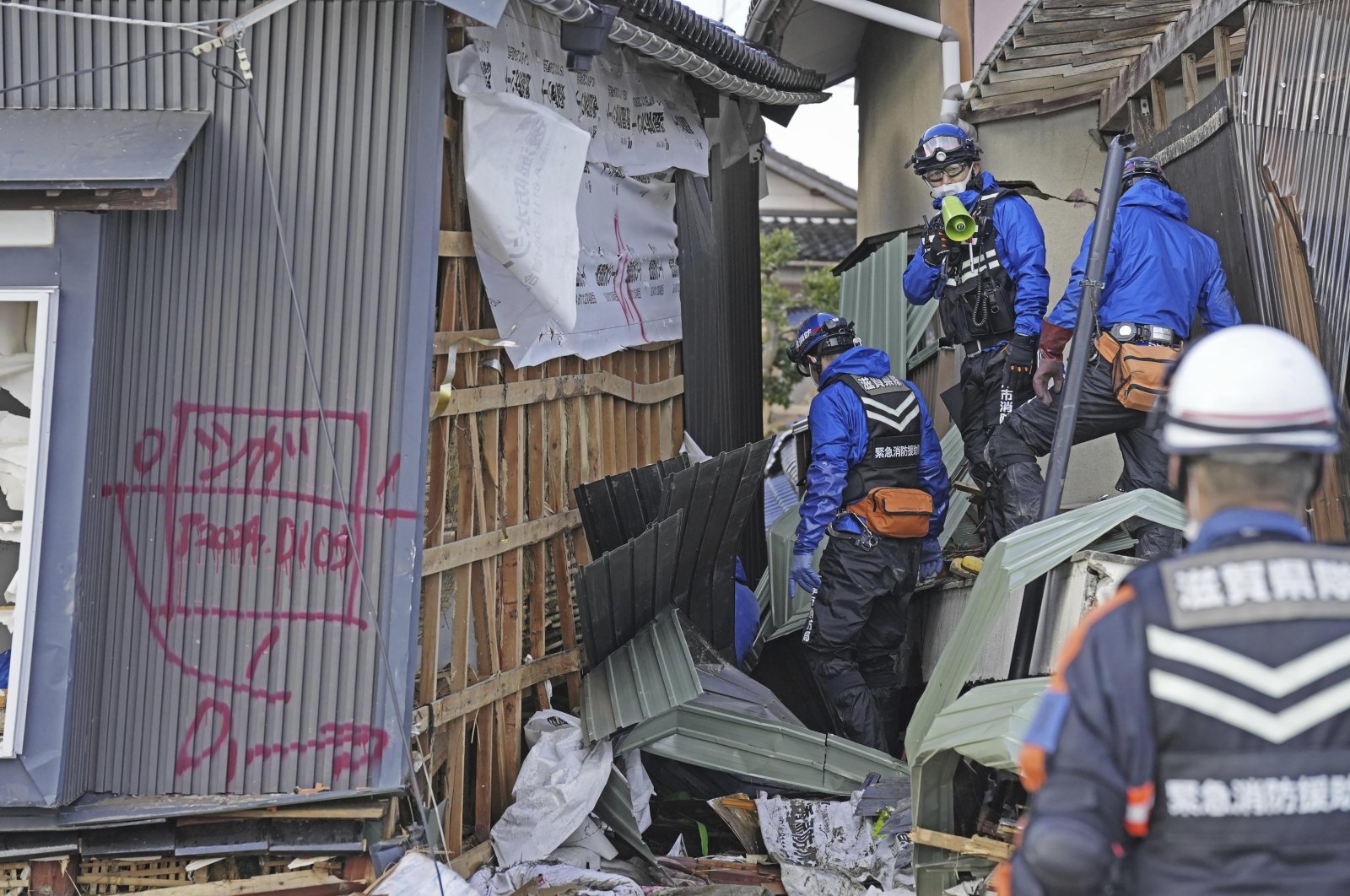 Rescuers conduct a search operation in Suzu, Ishikawa prefecture, Japan, Jan. 5, 2024. (AP Photo)