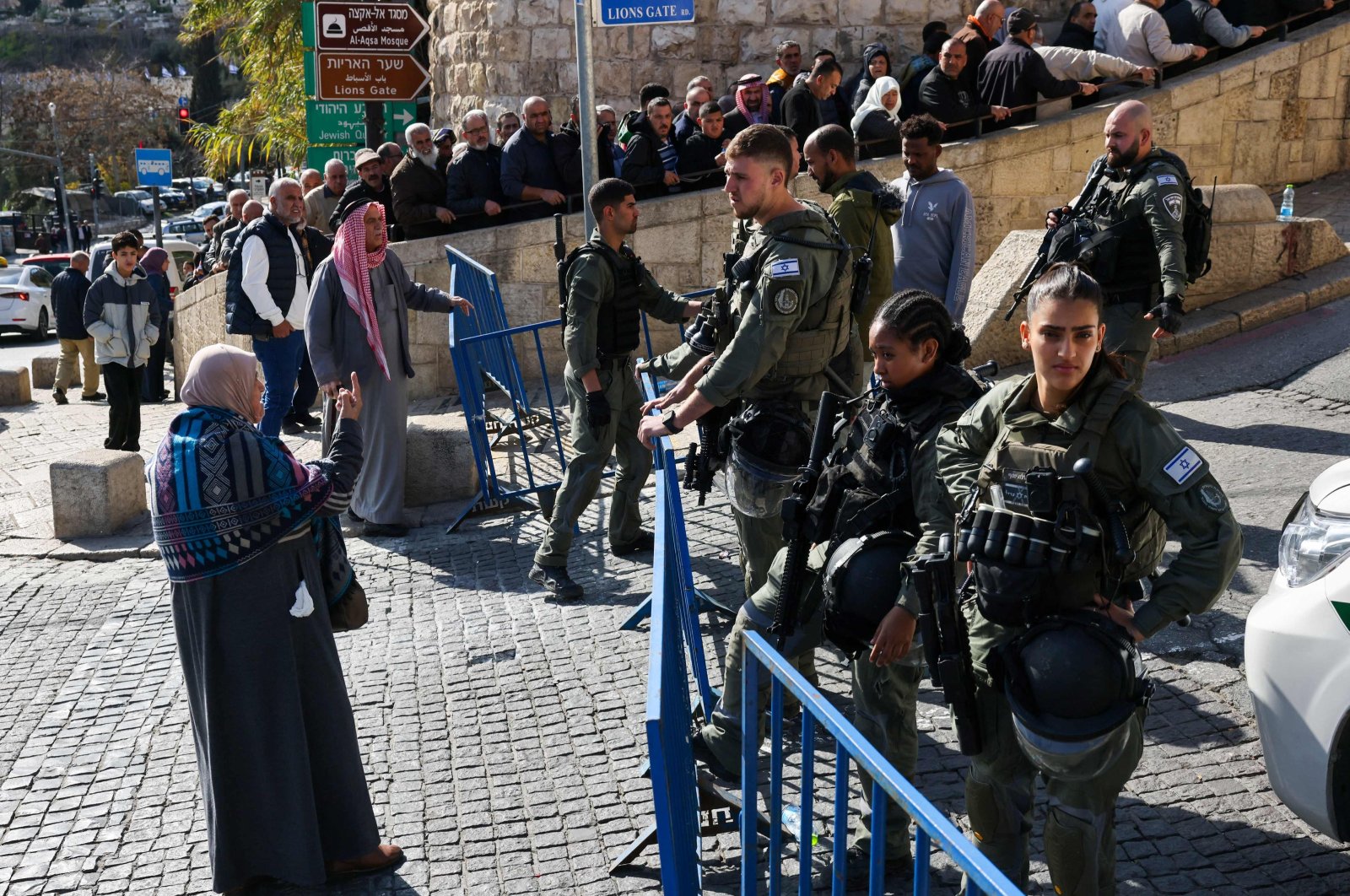 A Muslim woman speaks to the members of the Israeli security forces as other worshippers wait at a checkpoint near Lion&#039;s Gate to enter the Al-Aqsa Mosque compound for the Friday Noon prayer, Jerusalem, Palestine, Jan. 5, 2024. (AFP Photo)