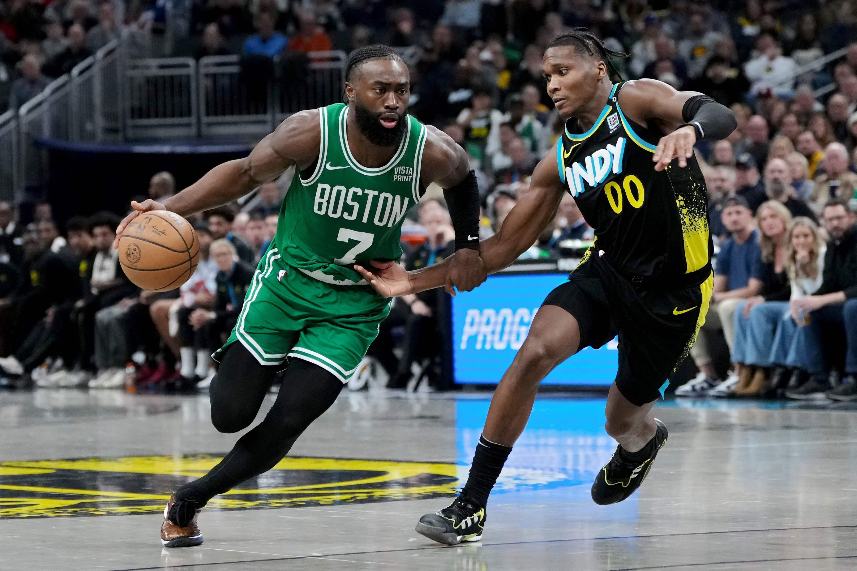 Jaylen Brown (L) of the Boston Celtics dribbles the ball while being guarded by Bennedict Mathurin (R) of the Indiana Pacers at Gainbridge Fieldhouse, Indianapolis, Indiana, U.S., Jan. 6, 2024. (AFP Photo)