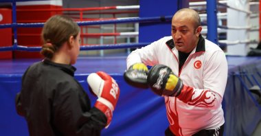 Kickboxing coach Esat Kaya, who began his fighting career in taekwondo secretly from his father, trains an athlete, Kayseri, Türkiye, Jan. 3, 2023. (AA Photo)