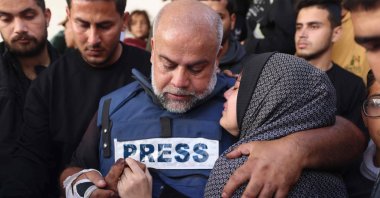 Al Jazeera&#039;s bureau chief in Gaza, Wael al-Dahdouh (C) hugs his daughter during the funeral of his son Hamza Wael al-Dahdouh, a journalist with the Al Jazeera television network, who was killed in a reported Israeli airstrike in Rafah, Gaza Strip, Palestine, Jan. 7, 2024. (AFP Photo)