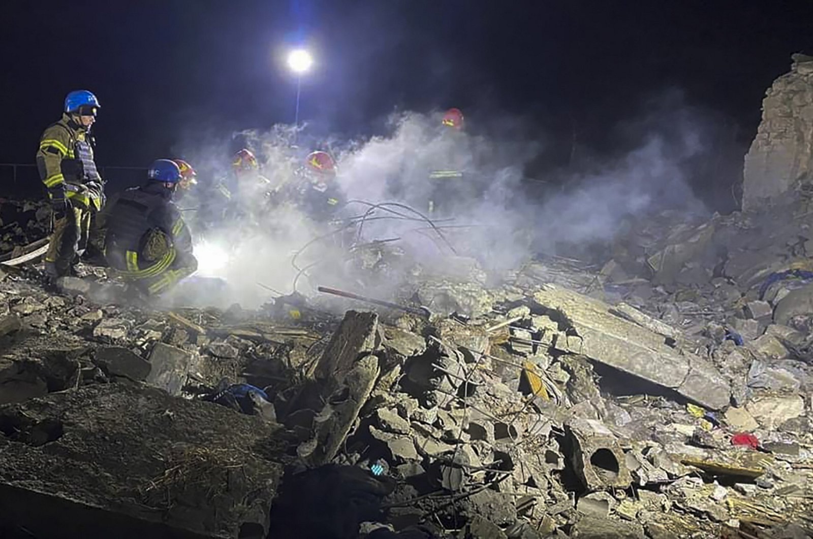 Ukrainian rescuers work at the site of a missile attack in the Pokrovsk district, Donetsk region, Ukraine, Jan. 6, 2024. (EPA Photo)