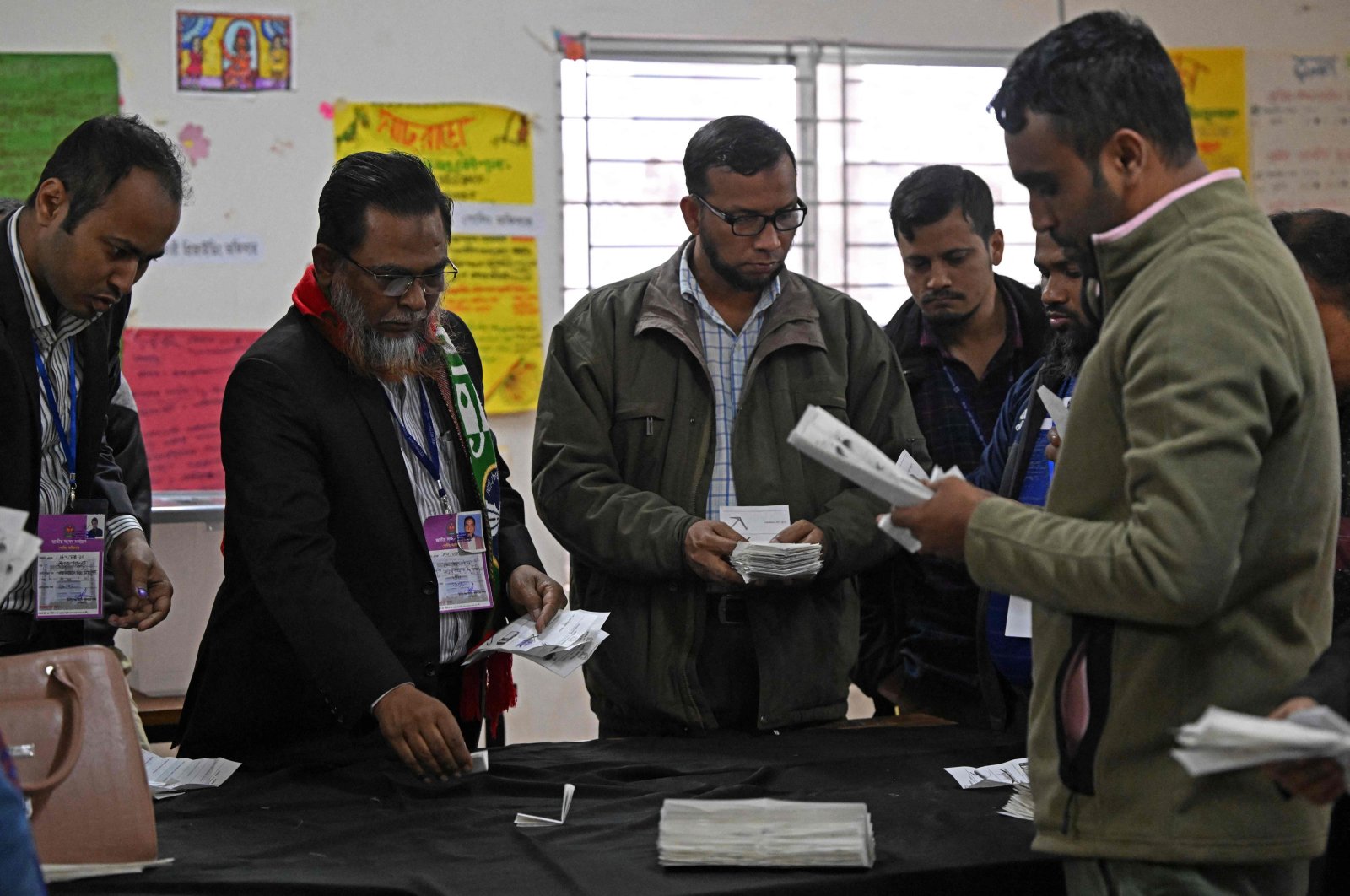 Election officials count ballot papers at a polling booth in Dhaka, Bangladesh, Jan. 7, 2024. (AFP Photo)