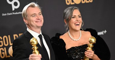 British director Christopher Nolan (L) and spouse British film producer Emma Thomas pose in the press room with the awards for Best Director - Motion Picture and Best Motion Picture - Drama for &quot;Oppenheimer&quot; during the 81st annual Golden Globe Awards, Beverly Hills, California, U.S., Jan. 7, 2024. (AFP Photo)