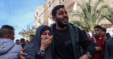 Relatives react after the body of a victim was found after a reported Israeli bombardment hit a car in Rafah in the southern Gaza Strip, Palestine, Jan. 8, 2024. (AFP Photo)