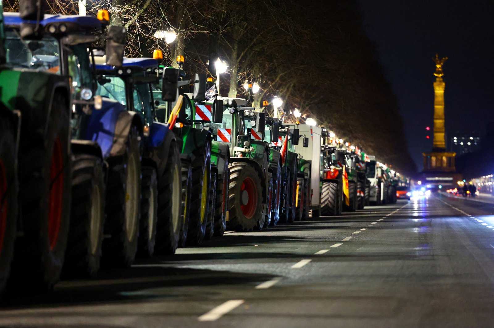 Tractors line up as German farmers take part in a protest against the cut of vehicle tax subsidies, near the Victory Column, Berlin, Germany, Jan. 7, 2024. (Reuters Photo)