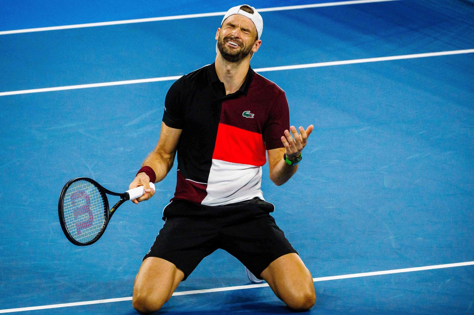 Bulgarian Grigor Dimitrov reacts following the men&#039;s singles final match against Danish Holger Rune at the Brisbane International tennis tournamen, Brisbane, Australia, Jan. 7, 2024. (AFP Photo)