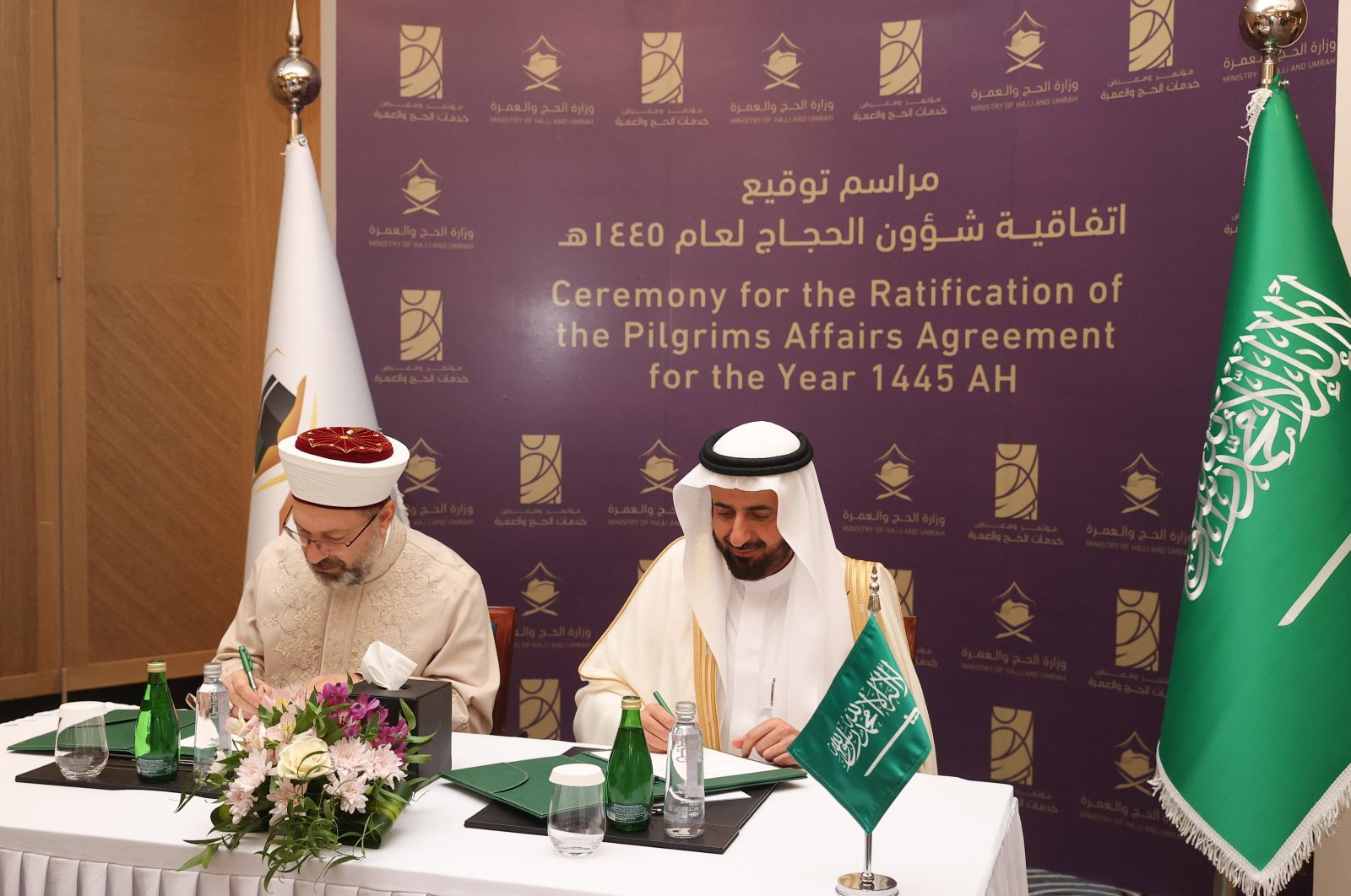 Presidency of Religious Affairs (Diyanet) head Ali Erbaş (L) signs the protocol with Saudi Minister of Hajj and Umrah Tawfig al-Rabiah, Jeddah, Saudi Arabia, Jan. 7, 2024. (AA Photo)
