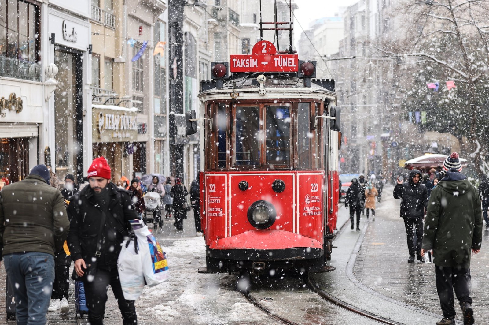 People walk on Istiklal Street, Istanbul, Türkiye, March 13, 2022. (AA Photo)