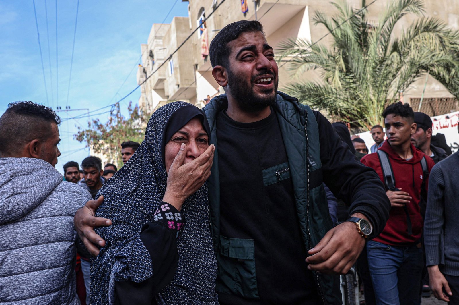 Relatives react after the body of a victim was found after a reported Israeli bombardment hit a car in Rafah in the southern Gaza Strip, Palestine, Jan. 8, 2024. (AFP Photo)